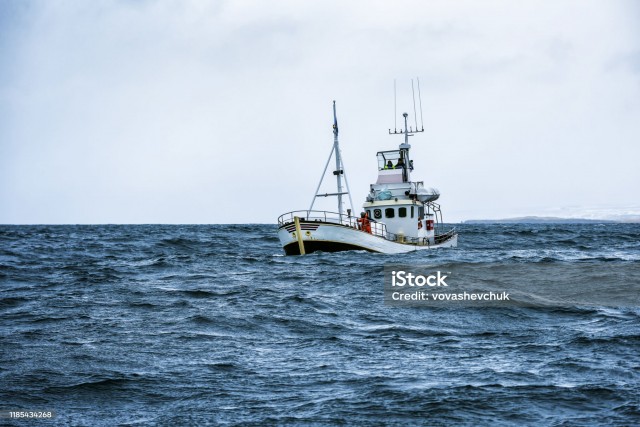 fishing boat in open cold sever ocean