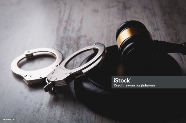 Legal law concept image - gavel and handcuffs
